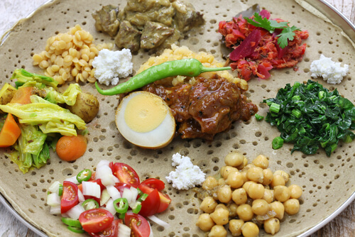 Ethiopian food - injera with different vegetable sauces