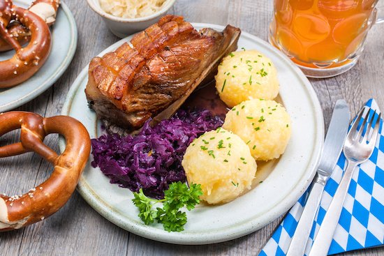 Typical German food: roast pork with red cabbage and knoedl (dumplings)