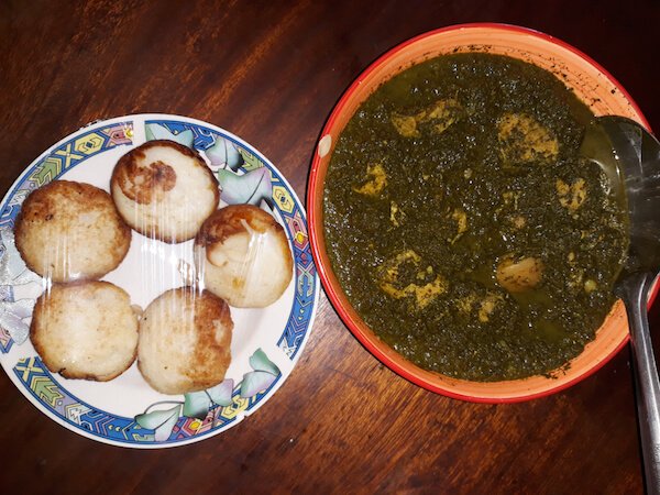 Traditional Malagasy meal: Mofogasy rice cakes and ravitoto