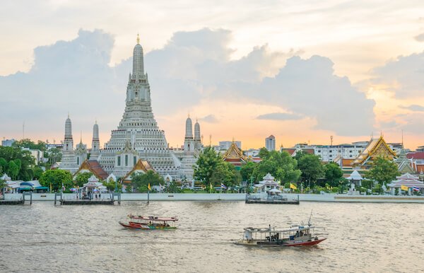 Wat Arun in Bangkok is a famous landmark of Thailand, here shown at sunset - shutterstock.com