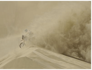 Dakar rally motobiker in sandstorm -image by dpa